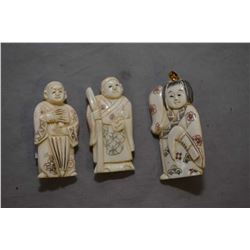 Three vintage carved ivory figures including one 2  netsuke and a pendant/brooch and a 1 3/4  carved