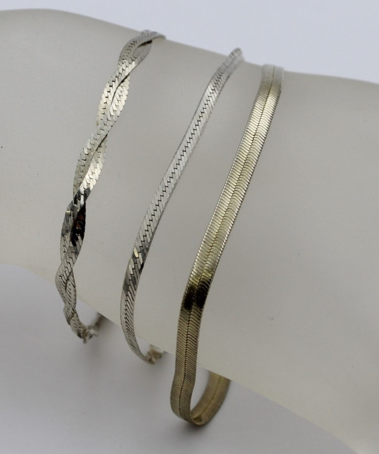 THREE STERLING SILVER BRACELETS