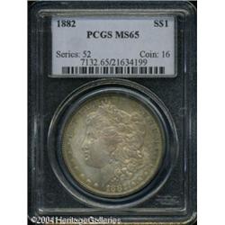 1882 S$1 MS65 PCGS. Low intensity multicolored ton 1882 S$1 MS65 PCGS.