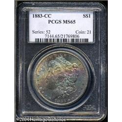 1883-CC S$1 MS65 PCGS. Multicolored rainbow-like t 1883-CC S$1 MS65 PCGS.