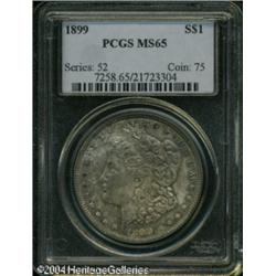 1899 S$1 MS65 PCGS. Cobalt-blue, golden-orange, an 1899 S$1 MS65 PCGS.