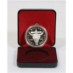 1982 REGINA CASED SILVER DOLLAR