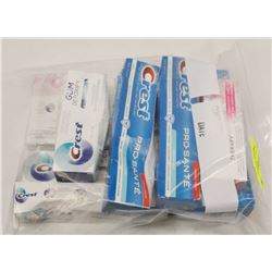 LARGE BAG OF ASSORTED TOOTHPASTES.