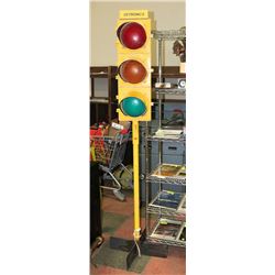 8FT MAN CAVE TRAFFIC LIGHTS ON STAND.
