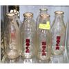 Image 1 : SHELF OF VINTAGE SQUARE MILK BOTTLES.