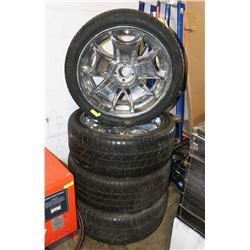 SET OF FOUR 24 INCH KMC RIMS WITH PIRELLI TIRES.