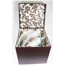 OTTOMAN FULL OF CRAFTING ITEMS.