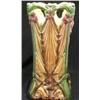 Image 1 : Un porte-parapluies Art Nouveau en faïence orné de fleurs retenant des draperies dans des tons bruns
