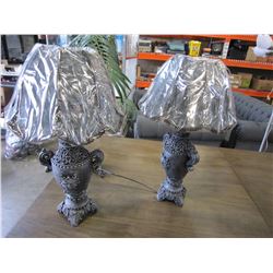 PAIR OF 2 BLACK CARVED RESIN LAMPS, WITH LION ACCENTS