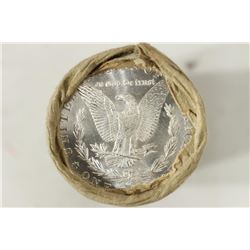 SHOTGUN ROLL OF MORGAN SILVER DOLLARS WITH UNC