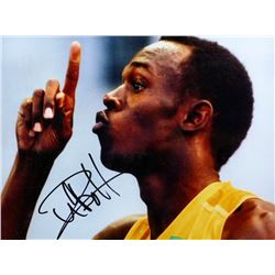 Usain Bolt - Olympic Gold Medallist, a signed photo, framed & glazed, 16 x 12 inches.Provenance: Wit