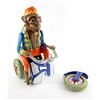Image 2 : Toys (1992) An oversized vintage Monkey riding a tricycle clockwork tinplate toy used in the Zevo To