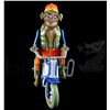 Image 3 : Toys (1992) An oversized vintage Monkey riding a tricycle clockwork tinplate toy used in the Zevo To