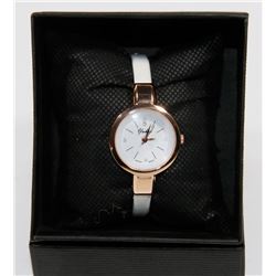 NEW YUKAE WOMENS WATCH WHITE STRAP SWISS MADE.