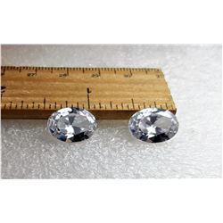 20) LOT OF 2 MATCHING OVAL WHITE ZIRCON GEMSTONES.