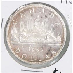 1963 CANADIAN SILVER DOLLAR COIN.