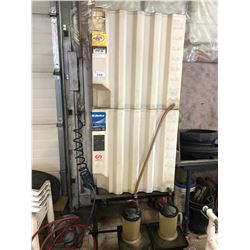 PAIR OF OIL TANKS ON METAL STAND