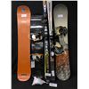 Image 1 : THREE SNOWBOARDS, 2 PAIRS OF SKIS, AND GOGGLES
