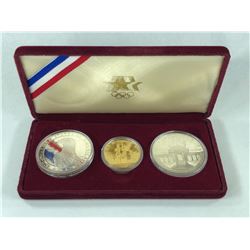 1984 US OLYMPIC GOLD $10.00 COIN WITH 2 SILVER $1.00 US COINS
