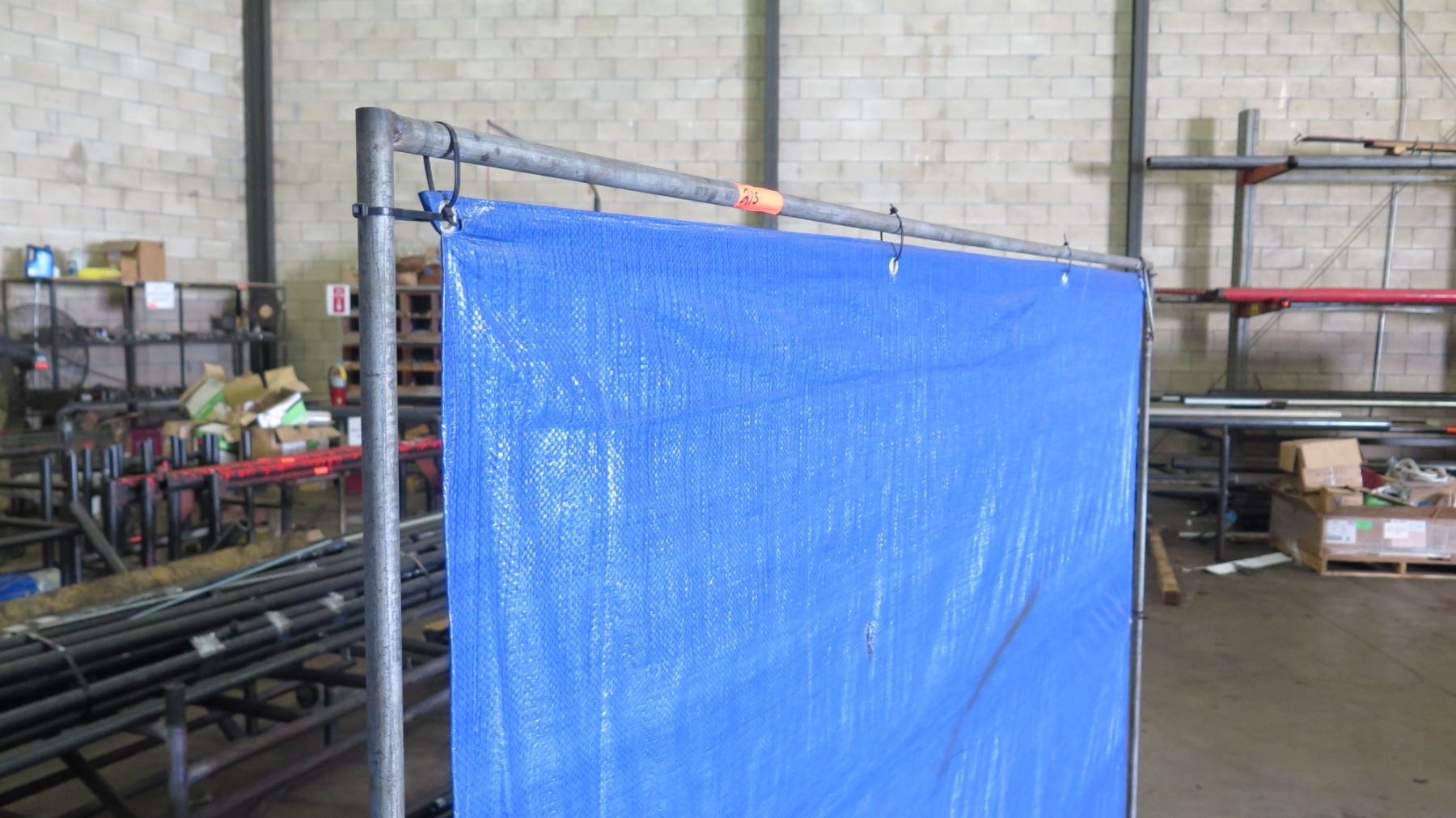 Pipe Rack Frame w/ Stretched Blue Tarp (Temporary Divider)