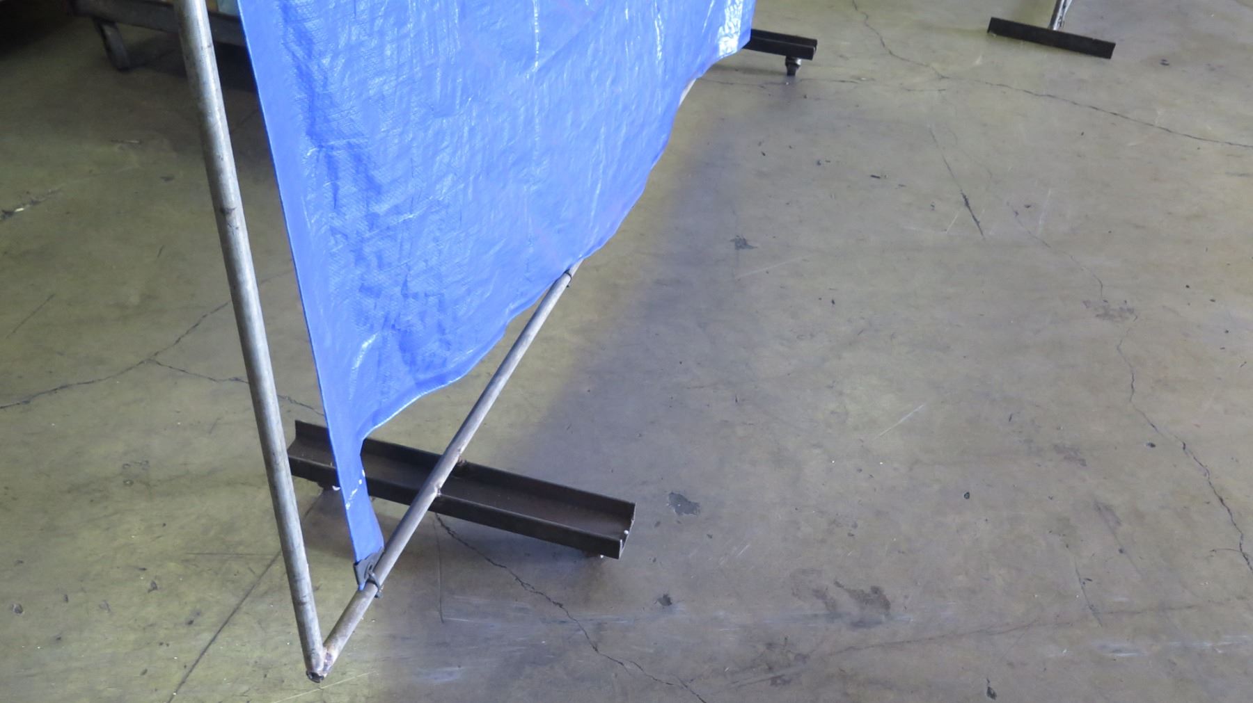 Pipe Rack Frame w/ Stretched Blue Tarp (Temporary Divider)