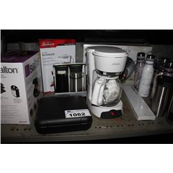 SHELF INCLUDING WAHL SHAVER, COFFEE MAKER, GRILL, PAN, WATER BOTTLES, AND MORE