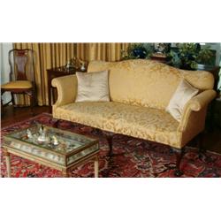 Pair of Carved Mahogany Framed Settees  in the Chippendale manner, upholstered in gold brocade, on c