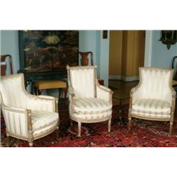 Pair of Ivory Lacquered andGilt Framed Arm Chairs in the late 18th Century French manner, in silk st