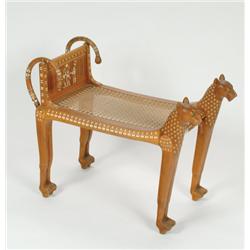 Carved and Inlaid Teak Bench  in the Egyptian manner, the frame formed by two stylized animals, flan