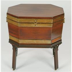 Early George III Lozenge Shaped Mahogany Cellaret brass bound and with brass side handles, on a matc