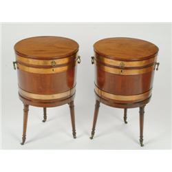 Pair of George III Mahogany Cylindrical Cellarets brass bound and with brass side handles and on tur