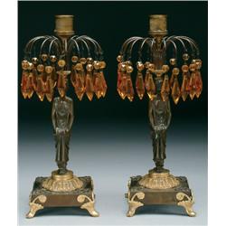 Pair of French Patinated and Gilt Bronze Candlesticks each formed as a standing female attendant in 