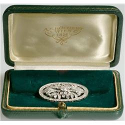 18k White Gold Oval Filgree Brooch bezel set with a brilliant cut diamond (approx. 0.38ct.) and deco