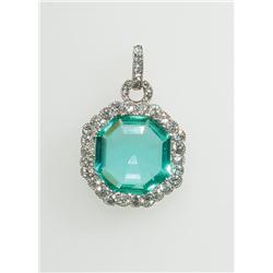 Platinum Pendant set with an octagonal cut emerald (approx. 4.00ct.) encircled and suspended by 26 E