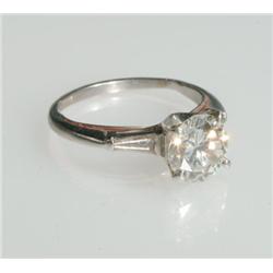 Platinum Solitaire Ring set with a brilliant cut diamond (approx. 2.30ct.) flanked by 2 tapered bagu