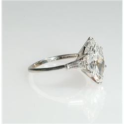 Birks Platinum Solitaire Ring set with a marquis cut diamond (approx. 3.08ct.) flanked by 2 tapered 