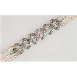 Triple Strand Cultured Pearl Bracelet with a platinum clasp and center panel set with 93 single cut 