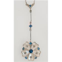 14k Yellow Gold And Platinum Pendant formed as a stylized flowerhead suspended by bar links and set 