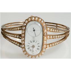 Unusual Lady's Hinged Bangle Duodial Wristwatch mid 19th century; brass keywind cylinder escapement 