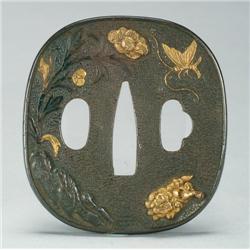 Shakudo Tsuba nearly circular, the obverse showing a peony and a butterfly in relief and onlaid with