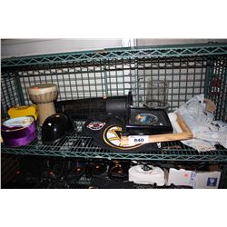 SHELF OF HOME ITEMS INCLUDING FAN, JERSEYS, DRUM, HELMET, ART, AND MORE