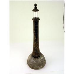 A serpentine table lamp, in the form of a lighthouse, on a granite base with shade, 22ins  