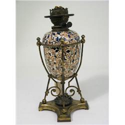 A Victorian ceramic oil table lamp, with floral decoration on brass stand, 16.5ins  