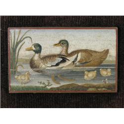A 19th century Italian micro mosaic panel of a pair of ducks, depicted with three ducklings in a pon