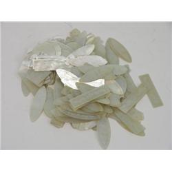 A quantity of mother of pearl counters, of various shapes including fish and ovals  