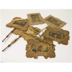 A pair of early Victorian Dobbs of London face screens, decorated with prints of domestic scenes on 