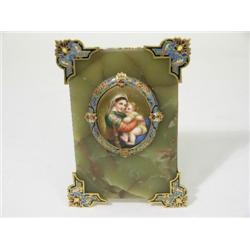 A Continental painted portrait miniature of the Madonna and child, with gilt and polychrome champlev