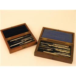 Two cased sets of technical drawing instruments, both with fitted trays of compasses and dividers  