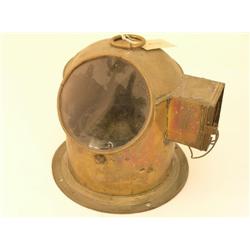 A ship's brass binnacle, with dome top and side light, glazed aperture revealing gimballed compass, 
