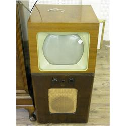 An A. Cossor Ltd Model 919 television set, with 10.5ins diam. tube in two tone walnut console, inclu